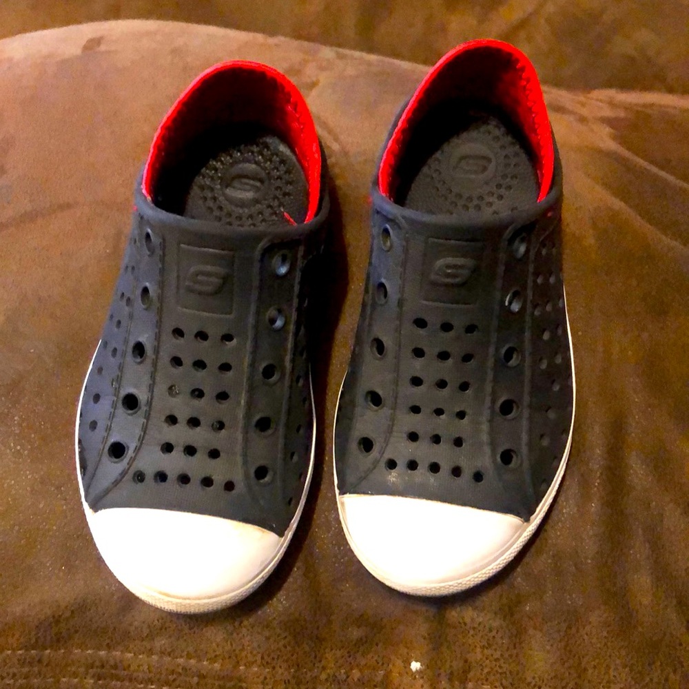 Black and red Skechers